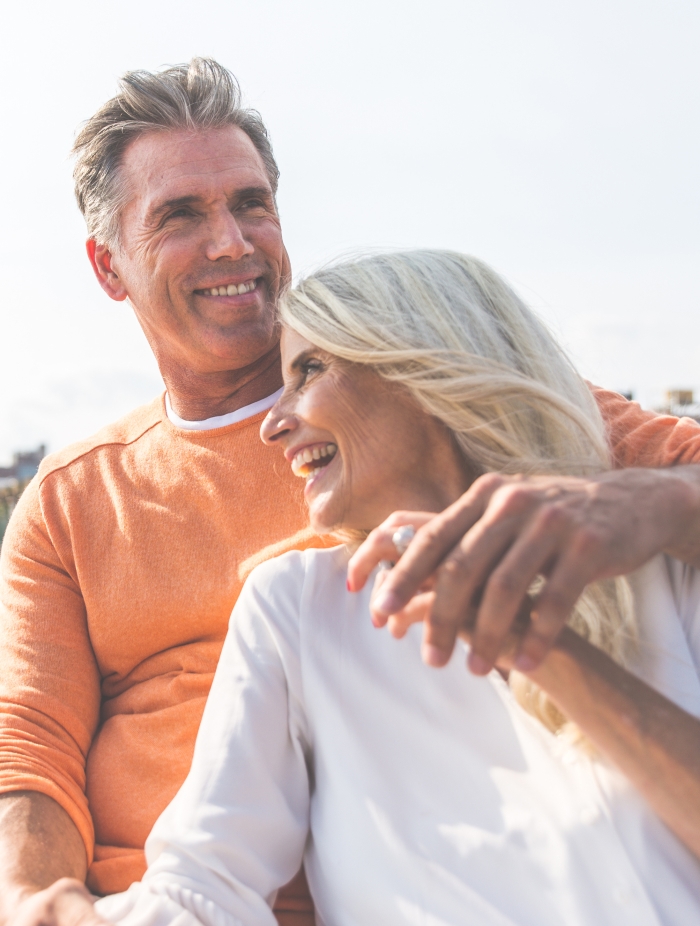 Man and woman enjoying their day thanks to restful night's sleep