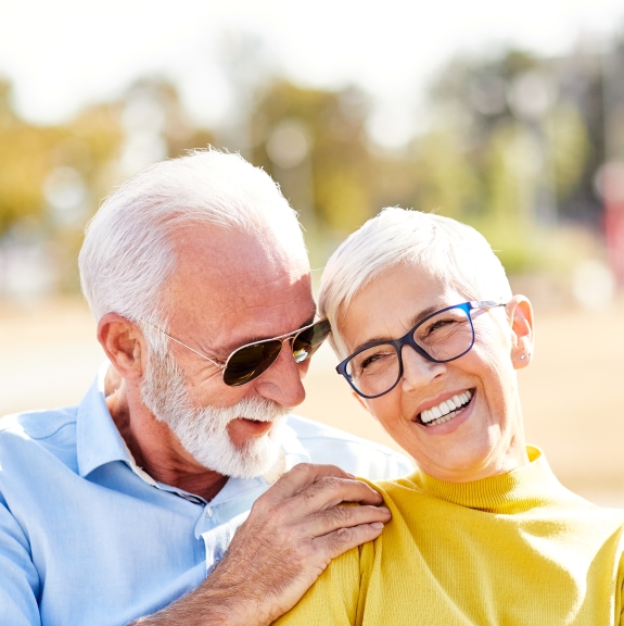 Older man and woman smiling together feeling rested thanks to sleep apnea services in Denver