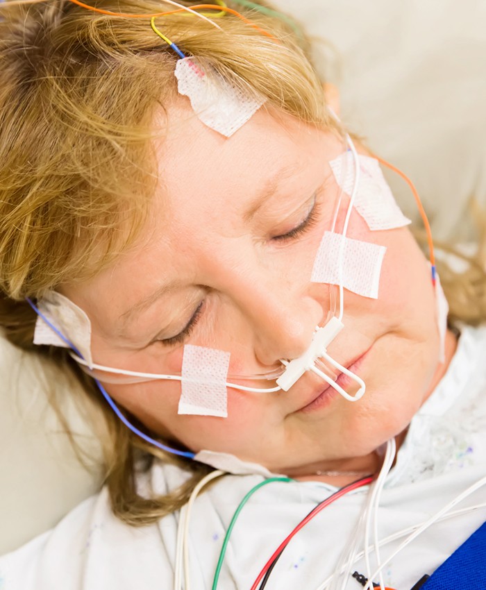 Patient with at home sleep testing equipment in place