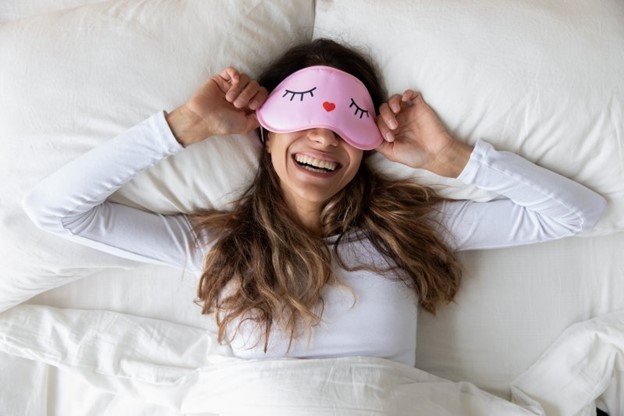 Woman with sleeping eye mask.