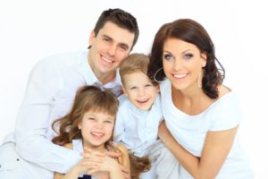 Happy parents and children smiling