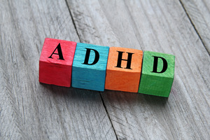 Four differently colored blocks spelling out “ADHD”